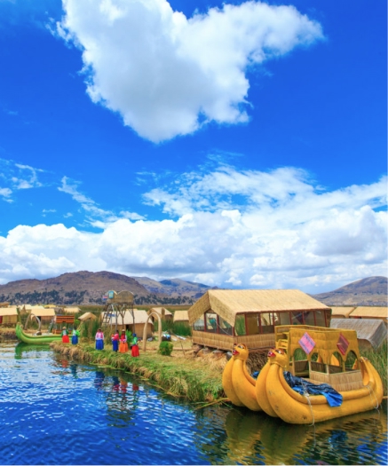 Full Day Tour Uros and Taquile Islands (Speed Boat) Lake Titicaca near Puno with a small boat on calm blue water and reed-lined shores under a clear sky